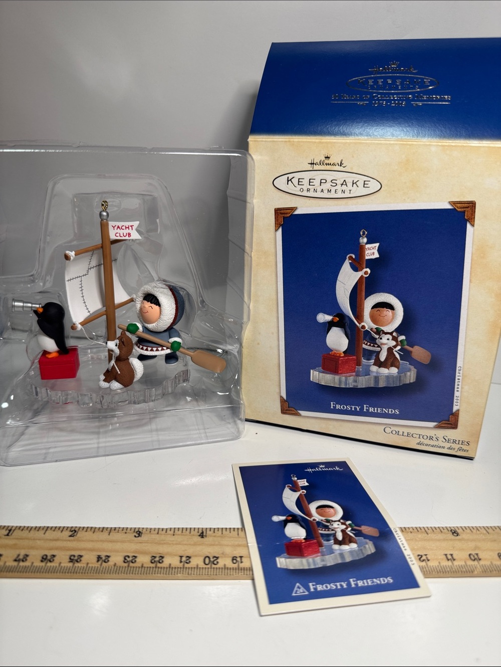 2003 Frosty Friends series, featuring an Inuit figure and a husky dog a sailboat